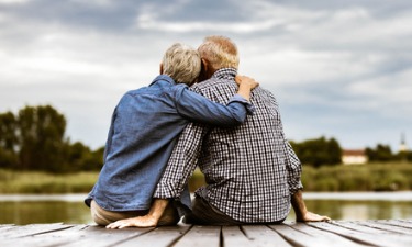 retirees sitting on dock