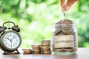 jar of coins for retirement with clock